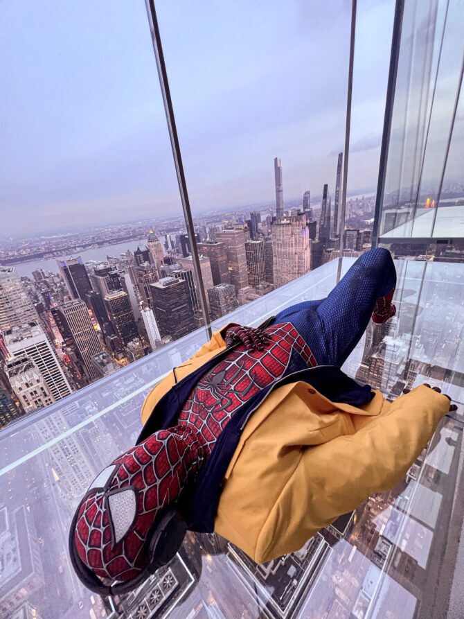 Summit One Vanderbilt NYC: Levitation - Sky Boxes | Spiderman Cosplay with yellow jacket and headphones 